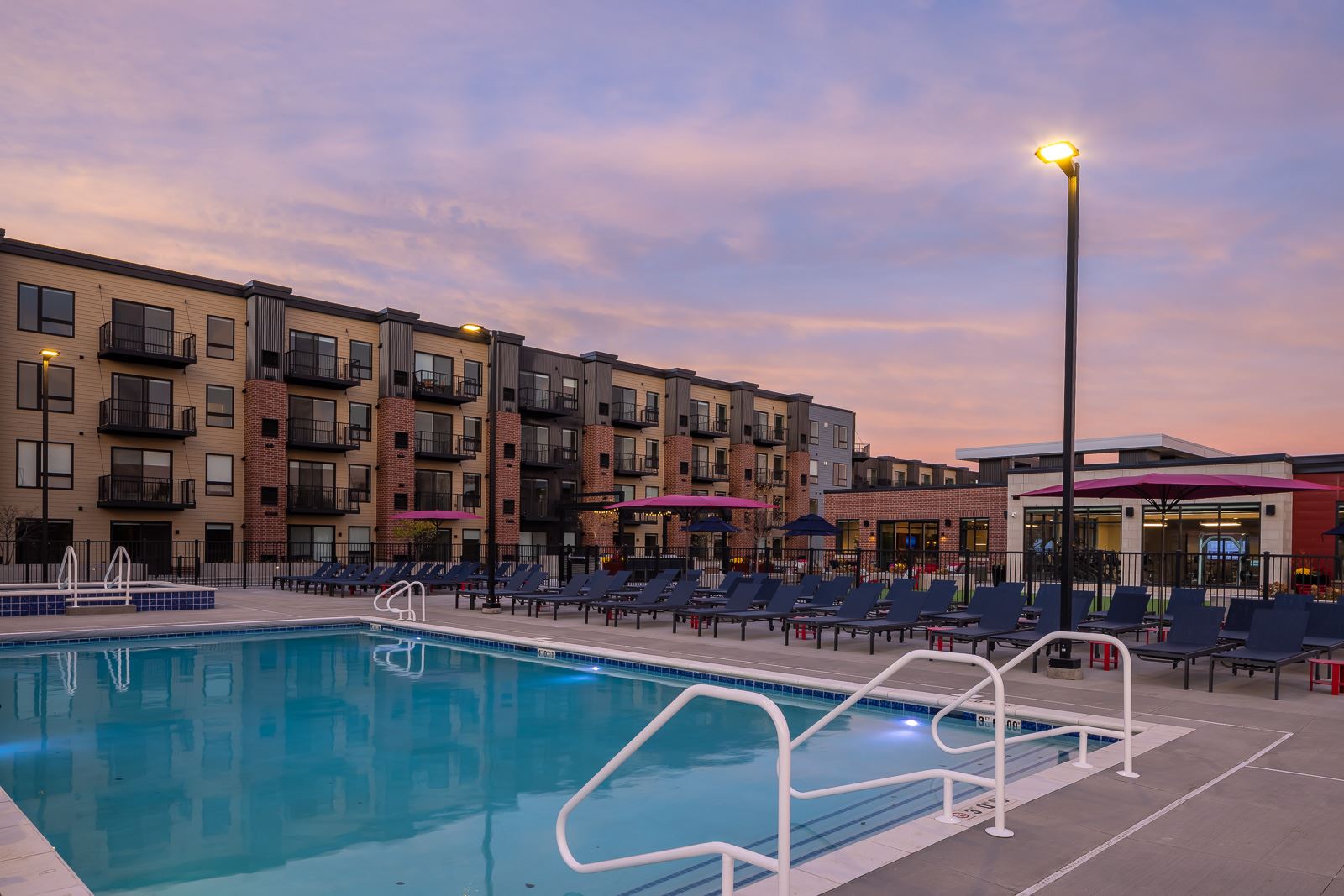 photo of square pool at sunset with outdoor light on